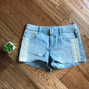 Light washed jean shorts with lace side!